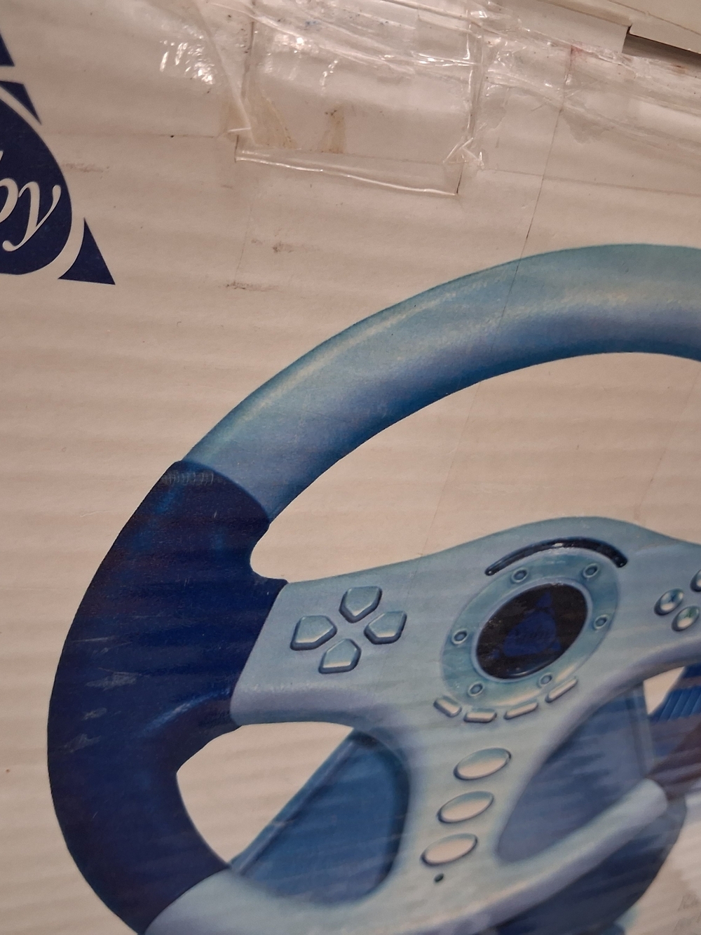 Nuby gaming racing wheel and pedal set designed for use with platforms PS2